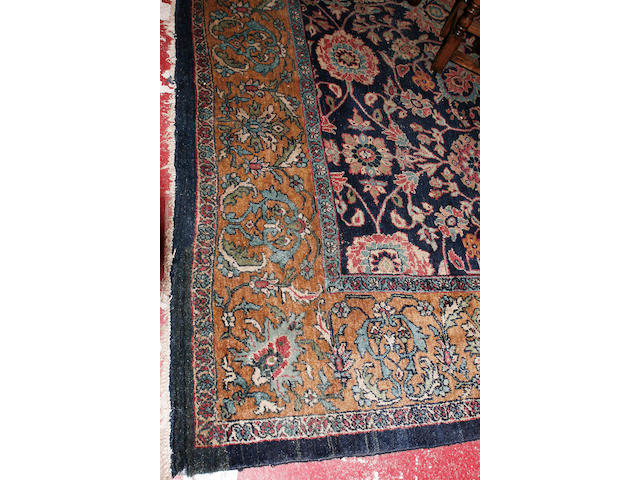 A large Tabriz carpet 350cm x 430cm.