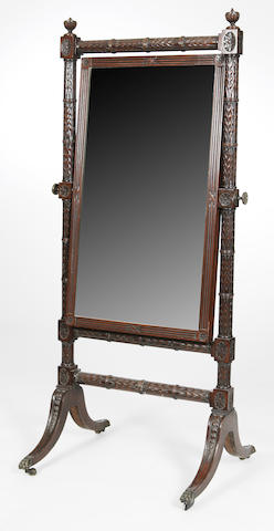 A late 19th century mahogany carved cheval mirror