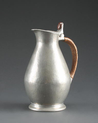 A pewter lidded jug, By Liberty & Co.,