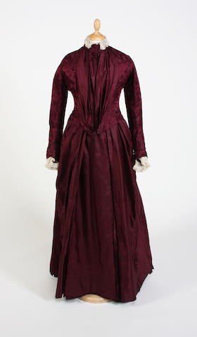 A late 19th century purple bustle back dress