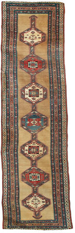 A North West Persian runner 11 ft 3 in x 3 ft 2 in (342 x 96 cm)