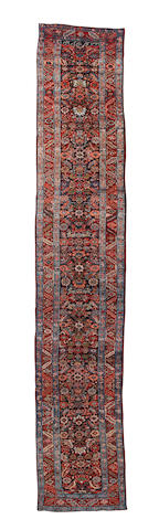 A Heriz runner North West Persia, 16 ft 11 in x 3 ft 1 in (516 x 95 cm)