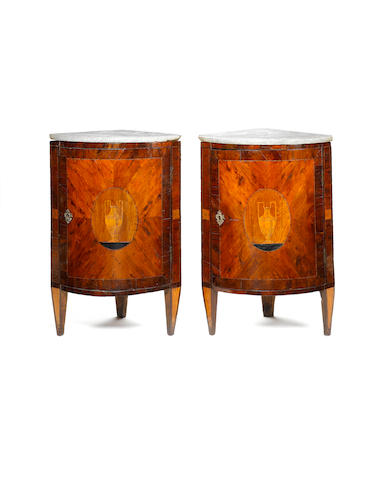 A pair of late 18th century Italian walnut and marquetry corner cabinets
