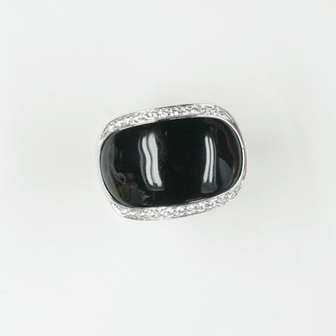 An onyx and diamond dress ring