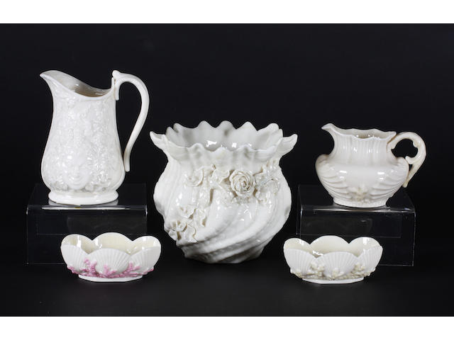 A Belleek small jardiniere, two jugs and two salts