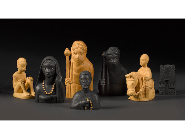 A carved thornwood tribal chess set by J. D. Akeredolu, Lagos, Nigeria, circa 1950,