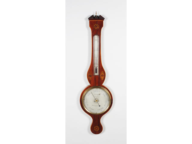 A late George III mahogany, boxwood line edged and floral paterae inlaid wheel barometer