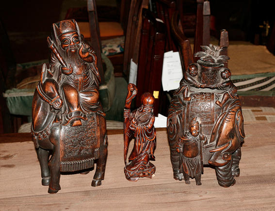 A Chinese bamboo carving of a deity seated on horseback