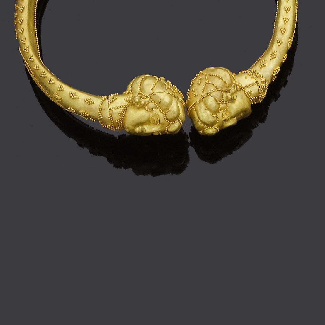 A gold bangle,