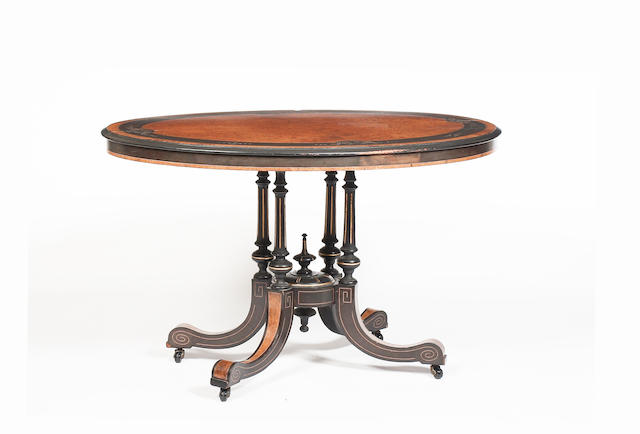A Victorian amboyna and ebonised loo table,
