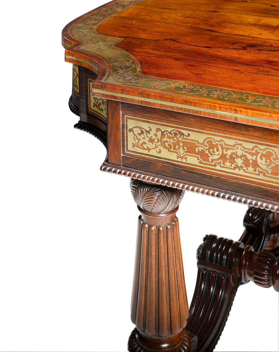 A Regency rosewood and brass marquetry Library Table attributed to Gillows