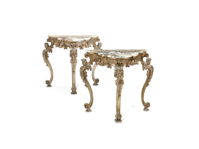 A pair of 19th century Italian Baroque style silvered wood console tables