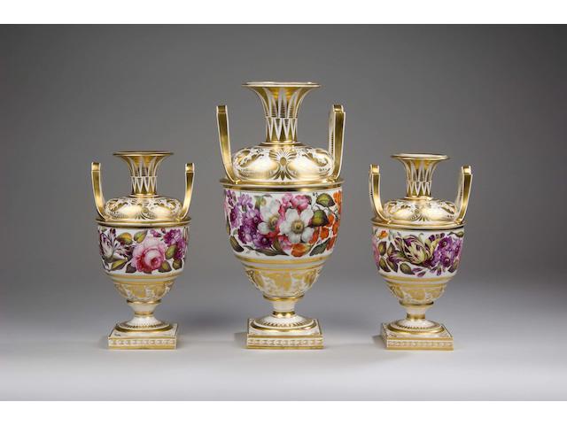 A garniture of three early 19th Century Derby vases