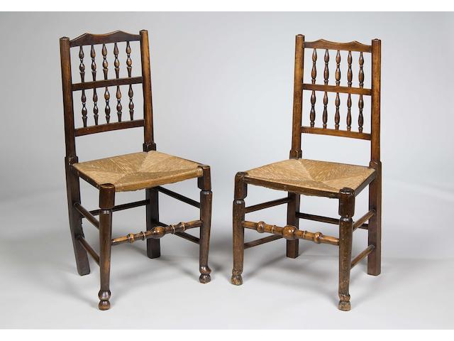 A matched set of six 19th Century and later oak spindle back dining chairs