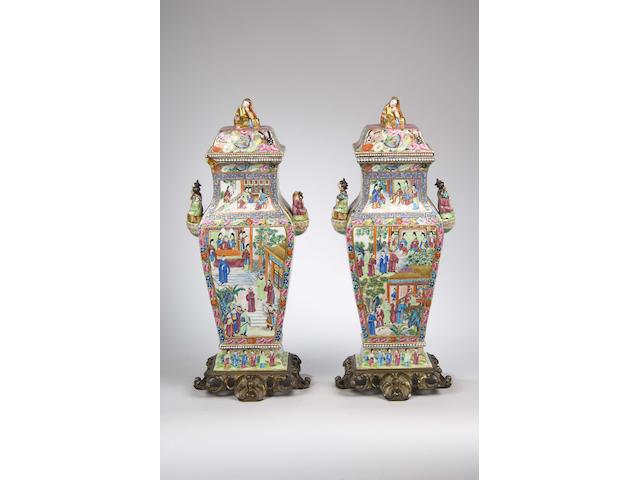 A fine pair of Canton famille rose squared baluster vases and covers mid 19th Century