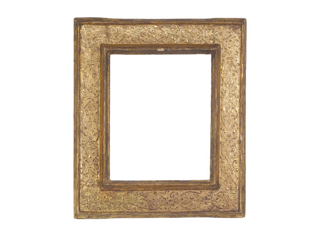 An Italian 16th Century carved and gilded cassetta frame