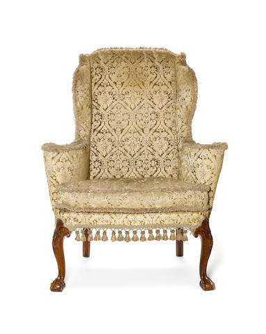 A George I carved walnut Wing Armchair