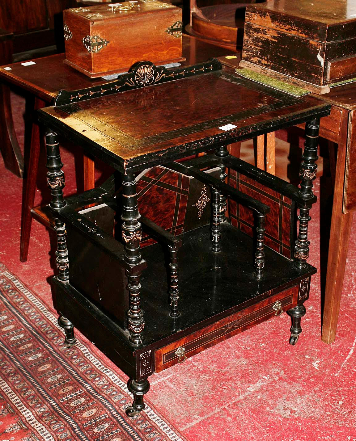 A late Victorian ebonised canterbury