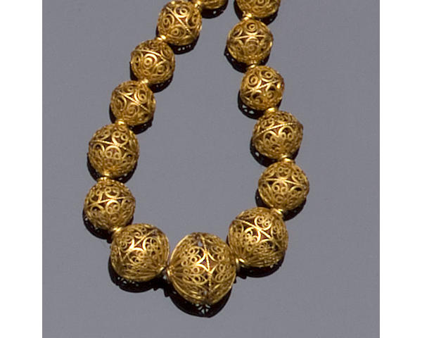 A filigree bead necklace,