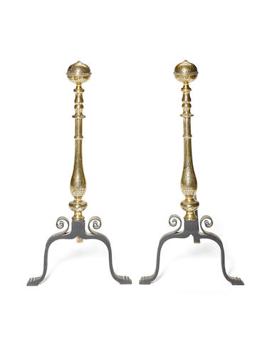 A pair of George I style engraved brass and iron Andirons