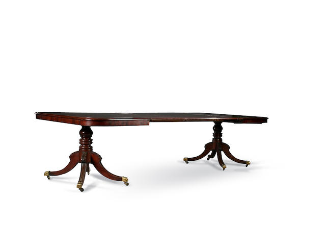 A George III and later mahogany twin pedestal dining table