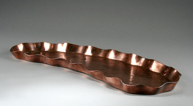 A kidney shaped copper tray by Henry Loveridge & Co. of Wolverhampton