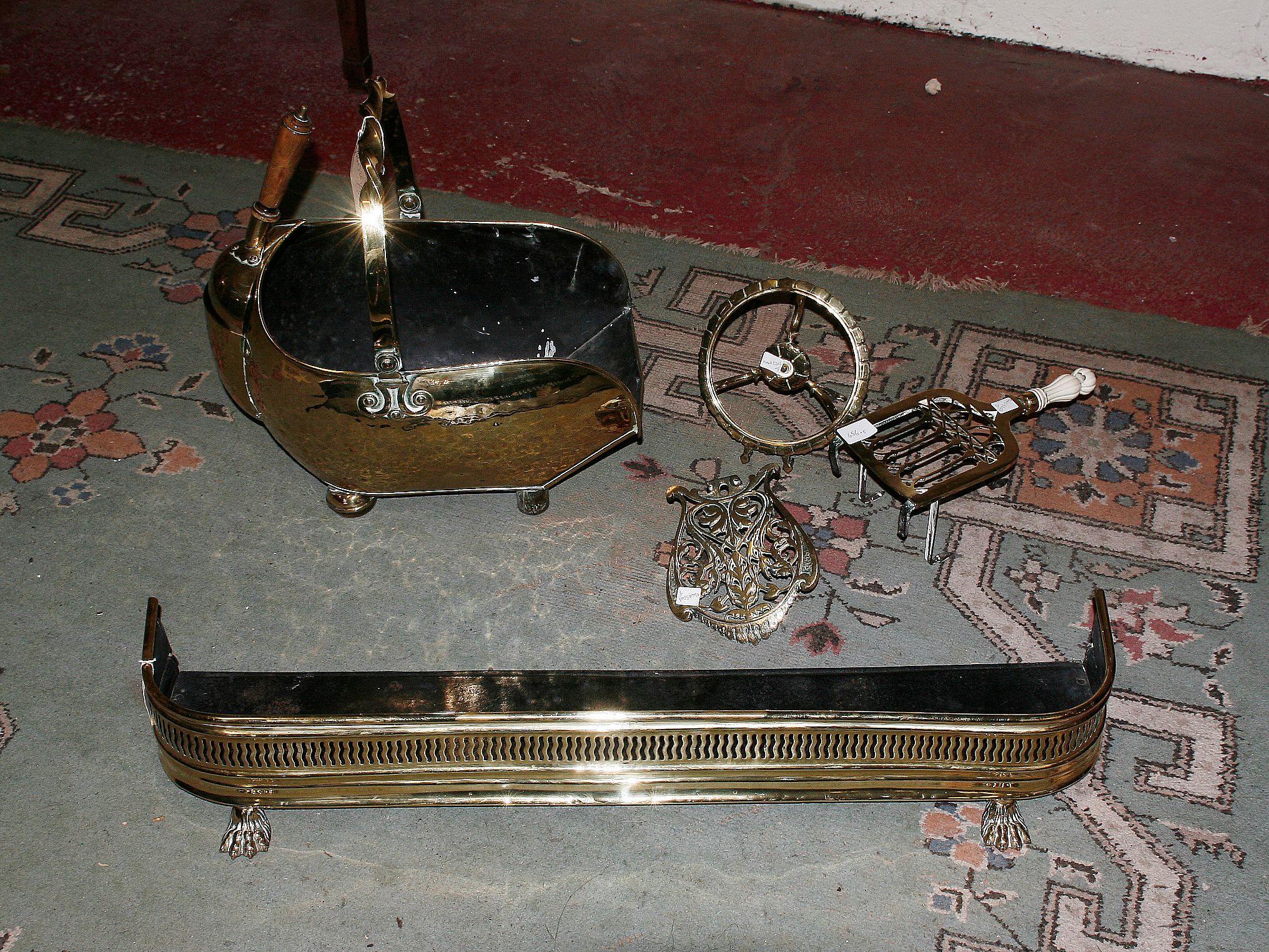 A brass fire curb