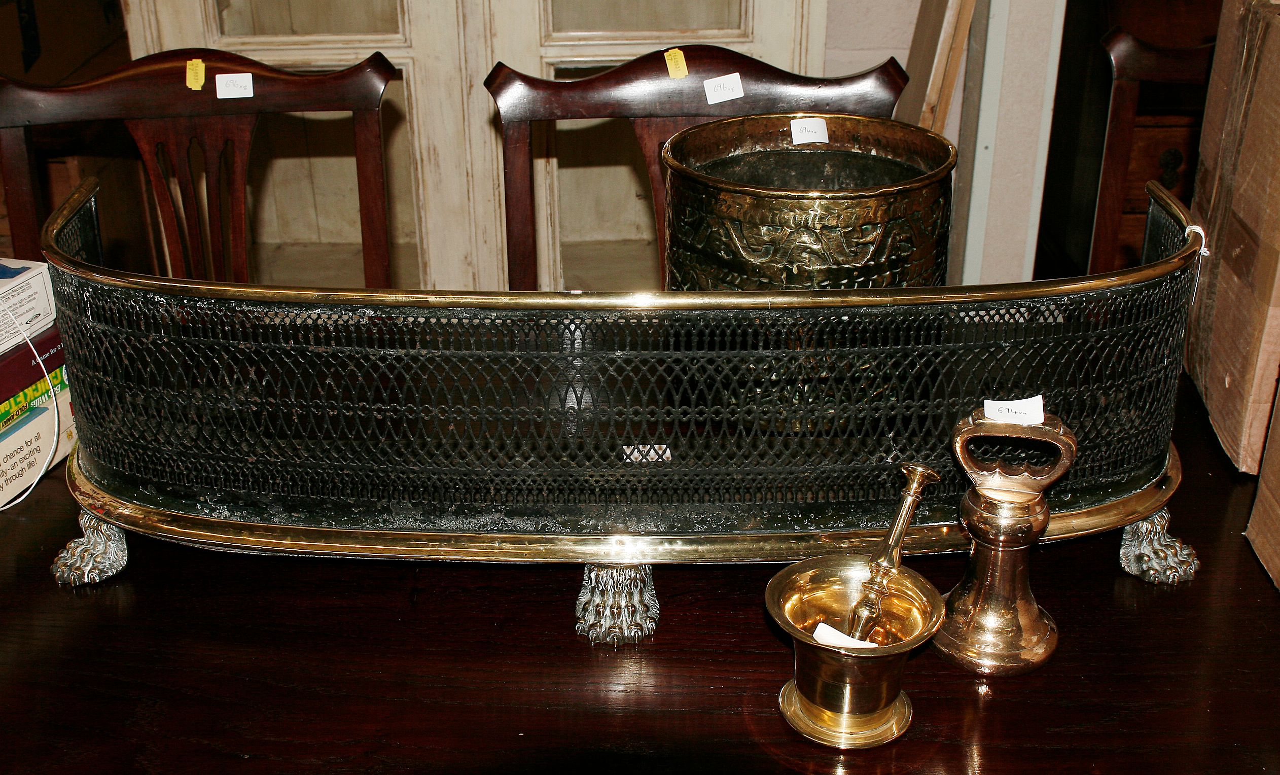 A brass fire curb