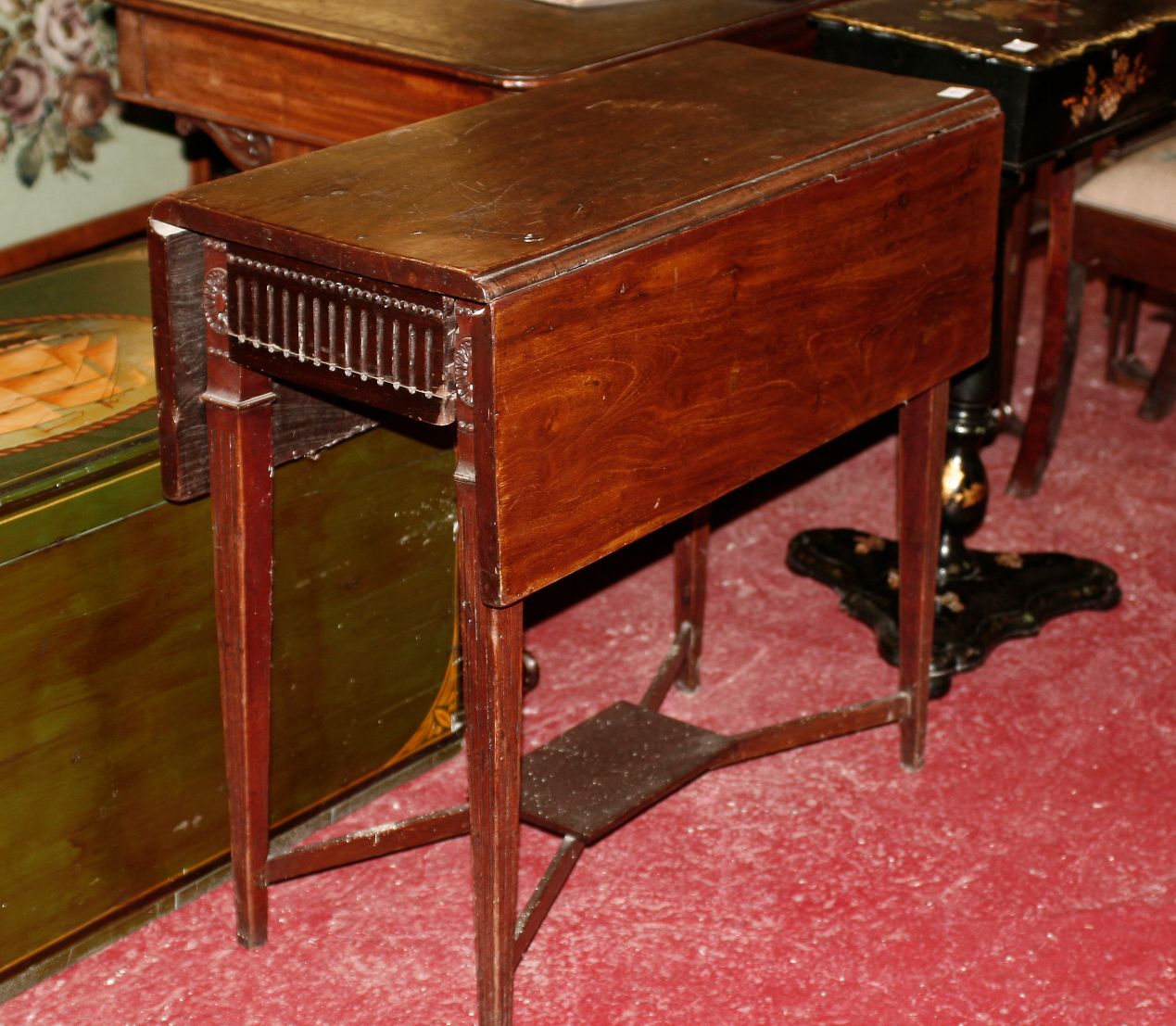 A 19th century walnut drop leaf table