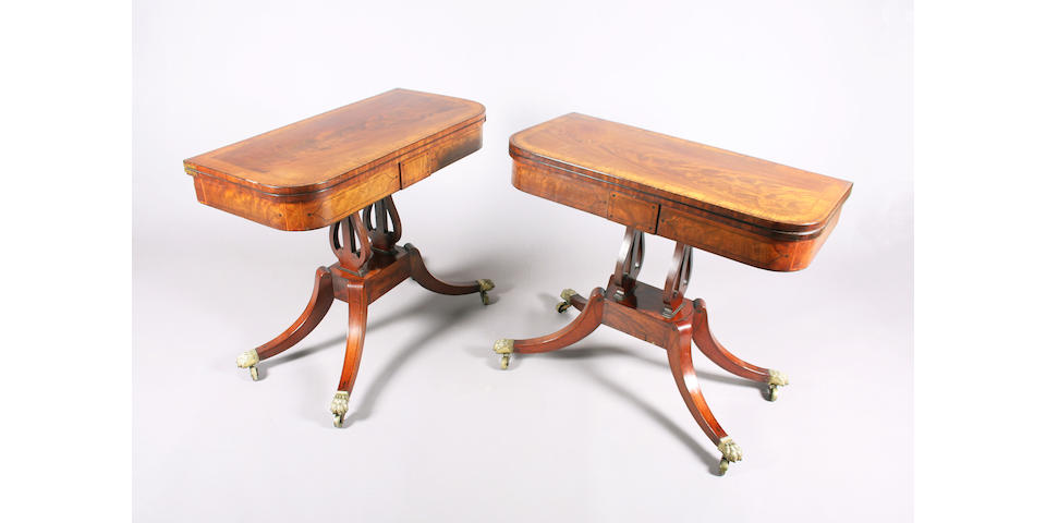A pair of George IV inlaid and figured mahogany pedestal card tables