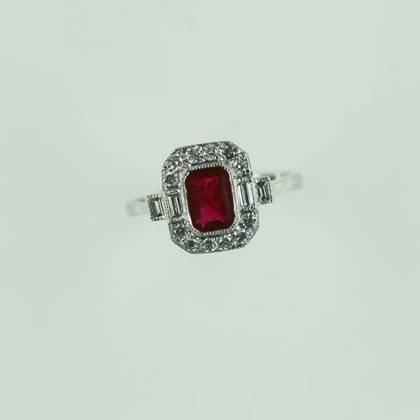 A ruby and diamond panel ring
