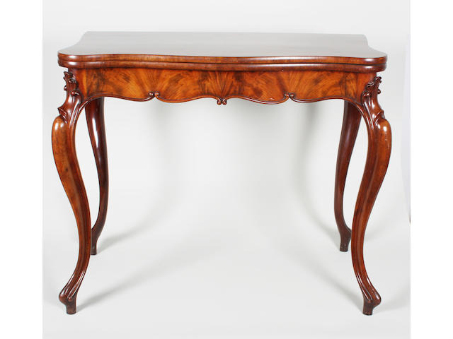 A clean mid/late 19th Century French Louis XV design figured mahogany serpentine foldover tea table