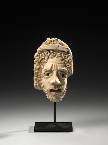 A Palmyran stucco theatre mask