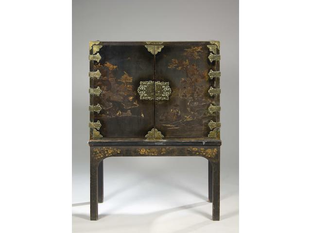 An 18th century Chinese export black lacquered cabinet on stand