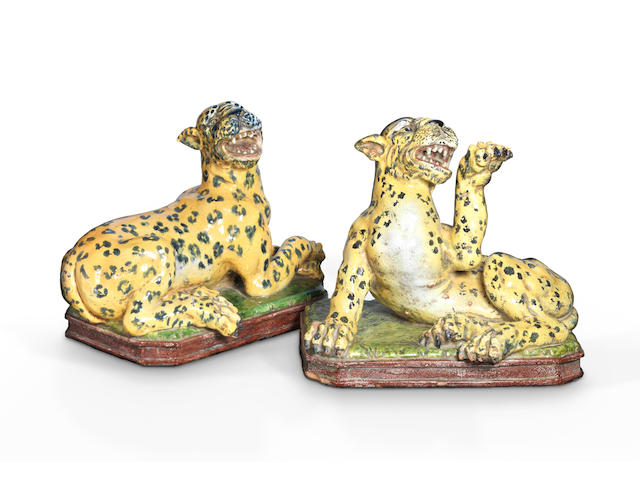 A fine and large pair of glazed pottery models of recumbent Leopards first half of the 19th century, probably French