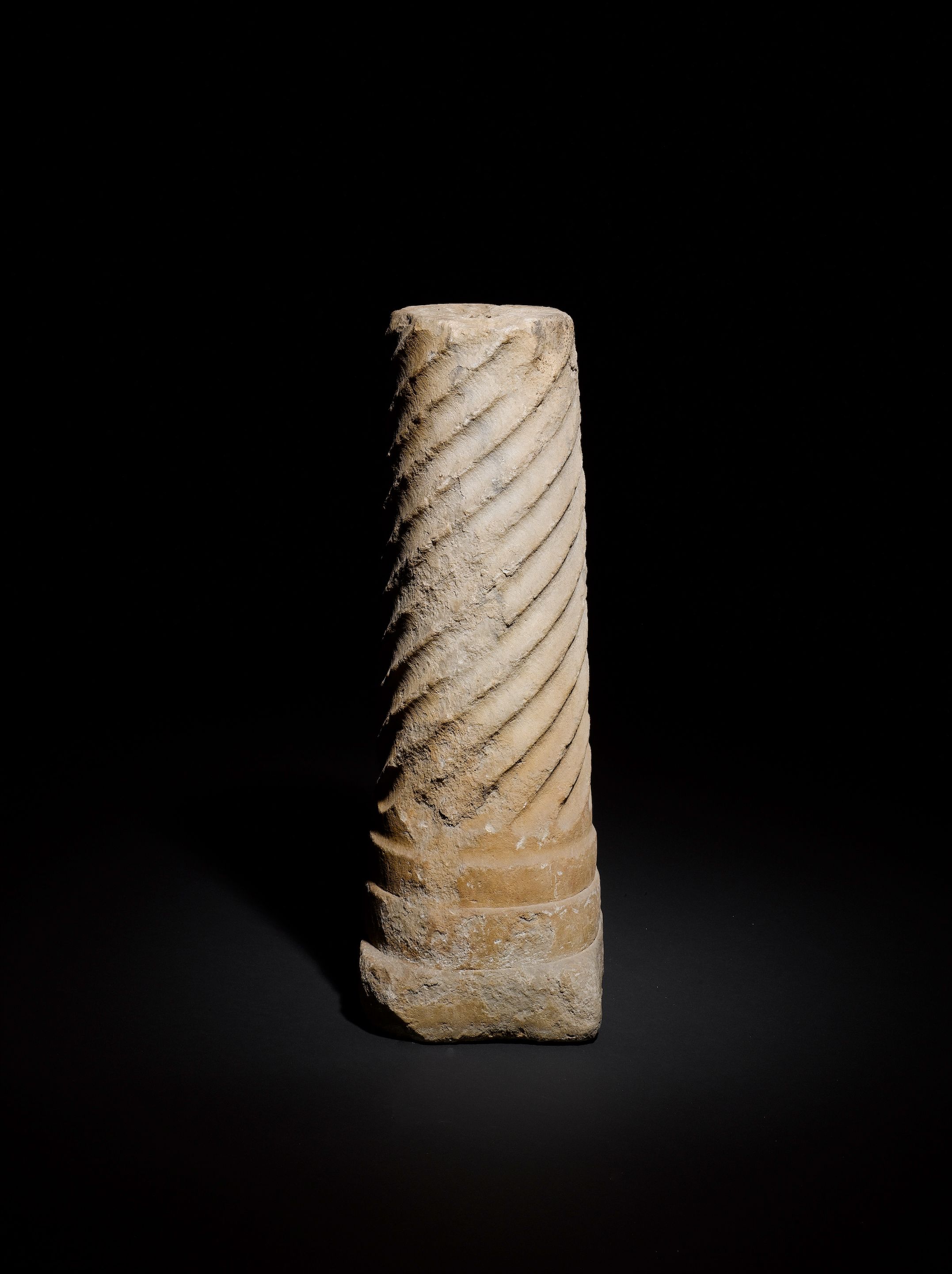 A strigilated marble column section