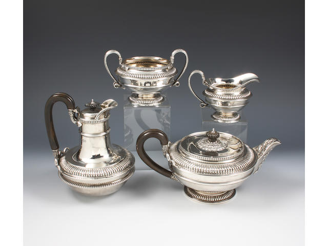 A late Victorian four piece tea set in the manner of Paul Storr By Messrs. Wellby, London, 1898-9,  (4)