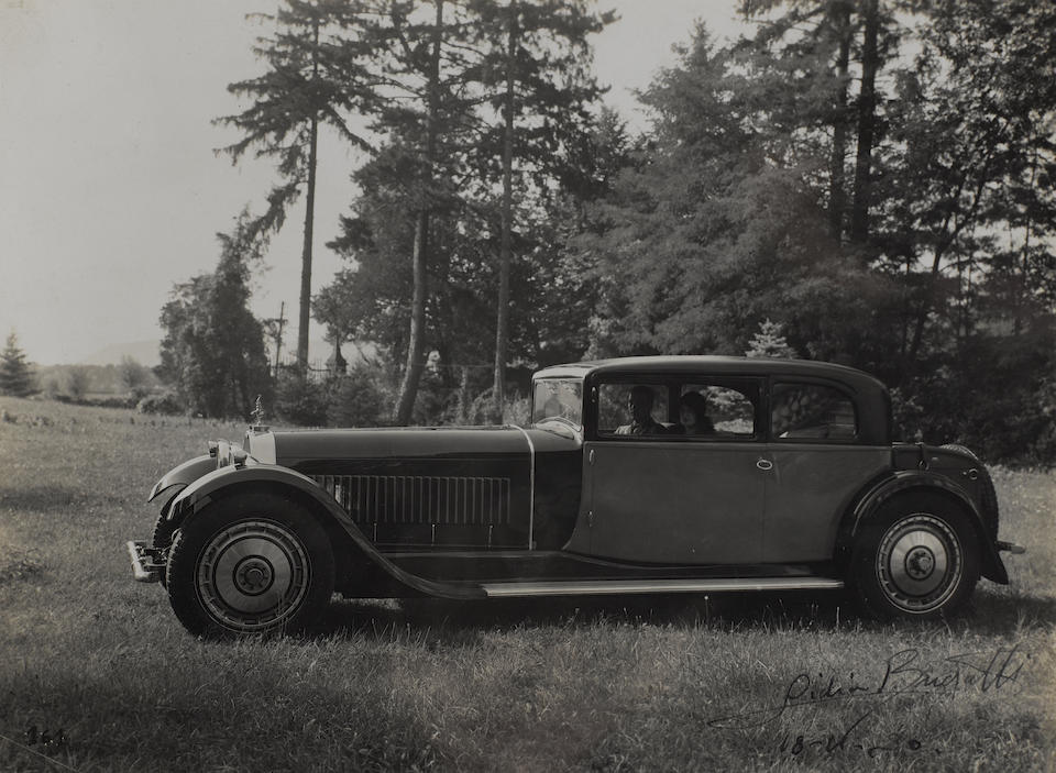 An album of photographs depicting the Bugatti family and cars,