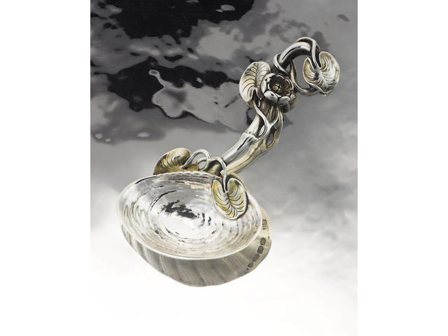 A Victorian cast silver and silver-gilt 'Mussel' caddy spoon, by Francis Higgins, London 1857,