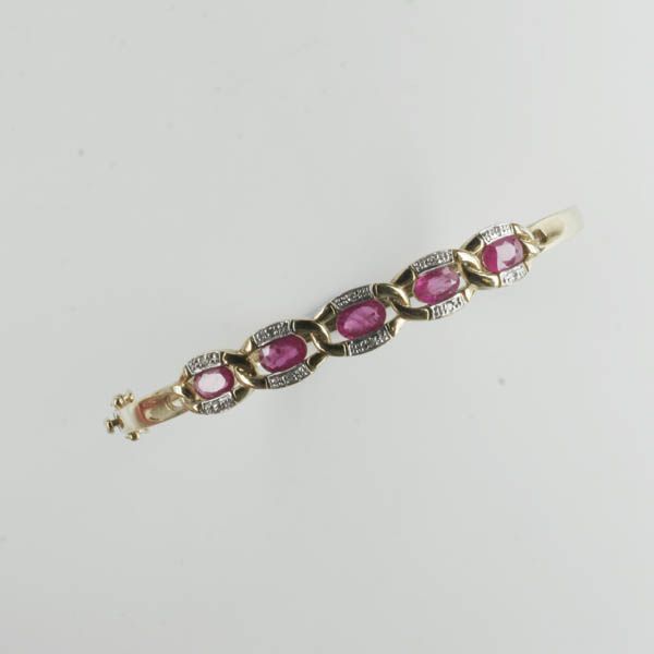 A ruby and diamond set hinged bangle,