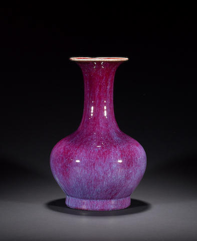A mottled peach bloom vase with trumpet neck
