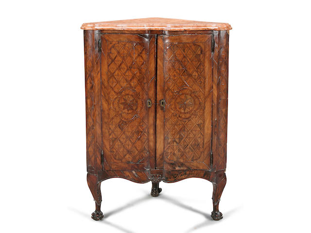 An 18th century Continental walnut and parquetry corner cabinet