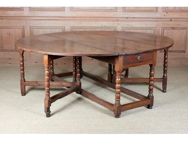 An exceptionally large William and Mary oak double-action gateleg table, circa 1700