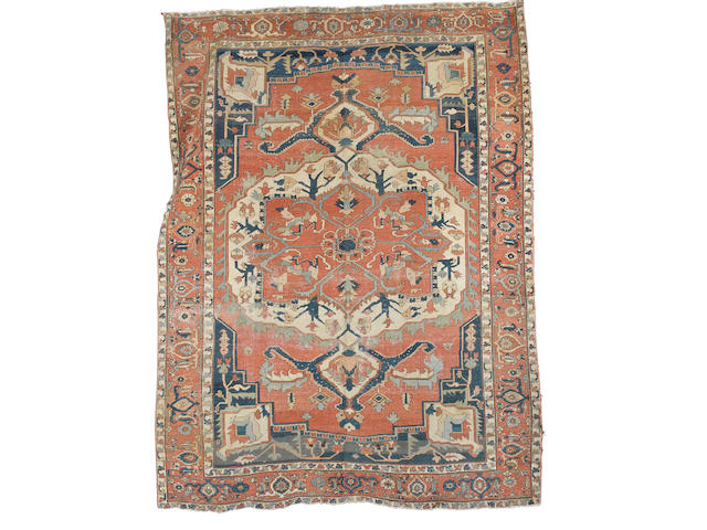 A Serapi carpet North West Persia, 12 ft 8 in x 9 ft 6 in (386 x 289 cm)worn,few rows missing at each end