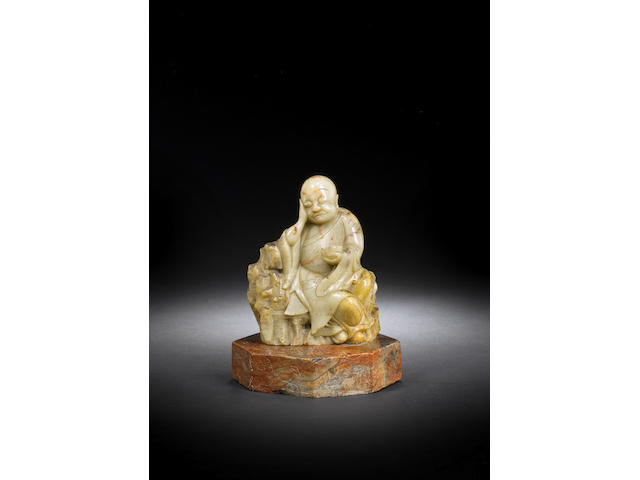 A soapstone 'sleeping luohan' carving 17th century
