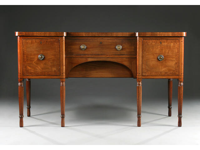 A George IV mahogany and ebony-strung inverted breakfront sideboard