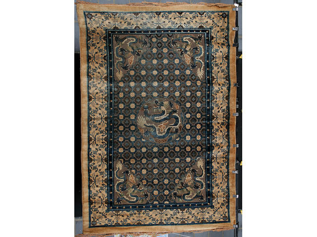 A Chinese silk and metal thread rug 282cm x 189cm