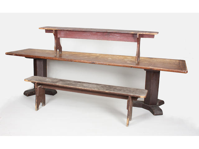 A 19th century stained pine rectangular top trestle refectory type table