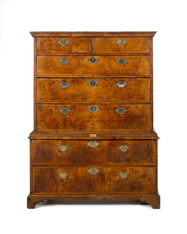 A George I walnut, crossbanded and featherbanded Chest on Chest