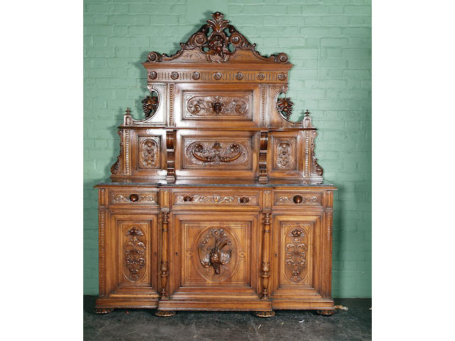 A large Italian carved walnut and marble-topped breakfront sideboard, 19th Century